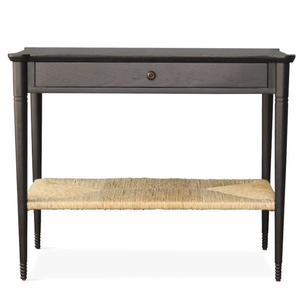 Our Holden End Table, designed by Peter Dunham for Hollywood at Home, is hand turned from white oak with a natural rush shelf. Perfect as a bedside table, nightstand, or side table.  
