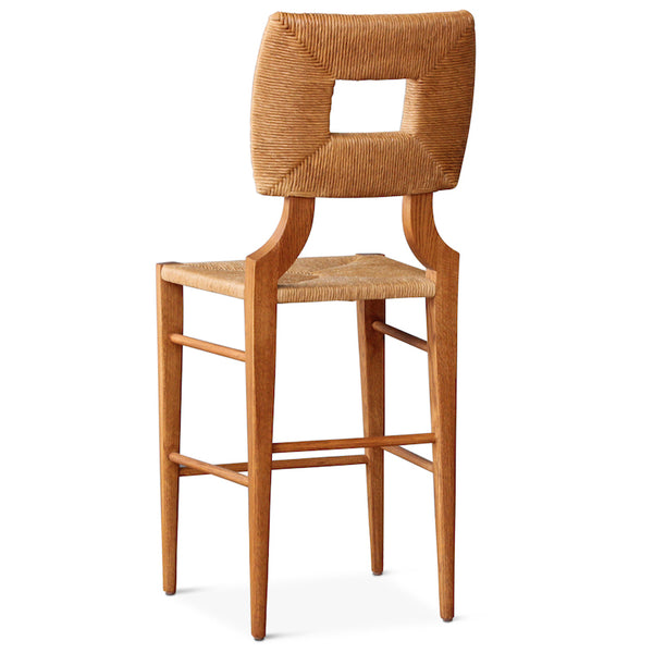 A bar or counter stool version of our iconic handmade How to Marry A Millionaire chair, a reedition of a chair our founder Peter Dunham bought at a Hollywood memorabilia auction and attributed to legendary designer T. H. Robsjohn-Gibbings.