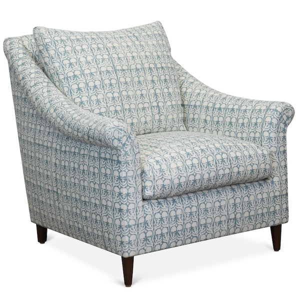 The Melrose Armchair, designed by Hollywood at Home founder Peter Dunham, is inviting and comfortable, featuring loose cushions, a turned arm, and tapered legs.