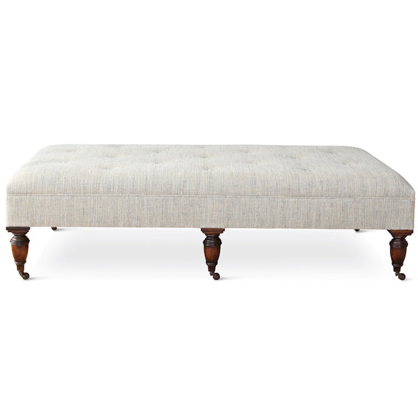 Our Garner Ottoman, designed by Hollywood at Home founder Peter Dunham, features turned wood legs in various finishes, with an upholstered top & button-tufted details. This piece is available COM.