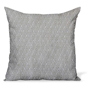 A decorative pillow or cushion made from Peter Dunham Textiles linen tribal print, Atlas in Stone, a neutral color
