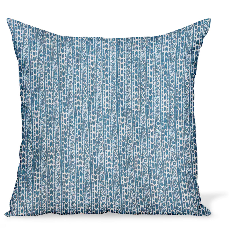 A decorative pillow or cushion made from Peter Dunham Textiles linen tribal print, Char in Indigo