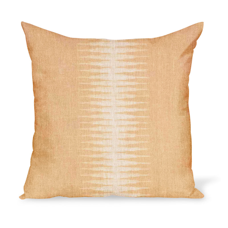A linen pillow made from a modern take on Ikat in a golden colorway, by Peter Dunham Textiles