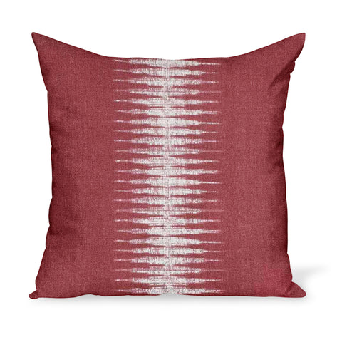 A linen pillow made from a modern take on Ikat in Pomegranate, a red colorway, by Peter Dunham Textiles