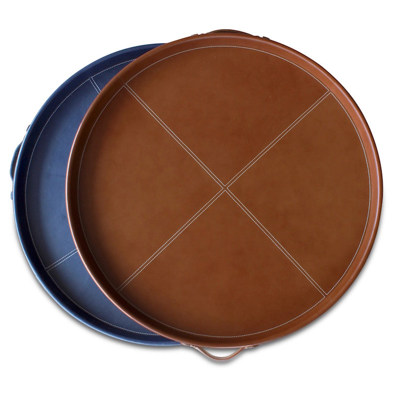 Round large and small leather wrapped trays in cognac and navy blue. Stylish gift or perfect home accessory! Designed by Peter Dunham for Hollywood at Home.